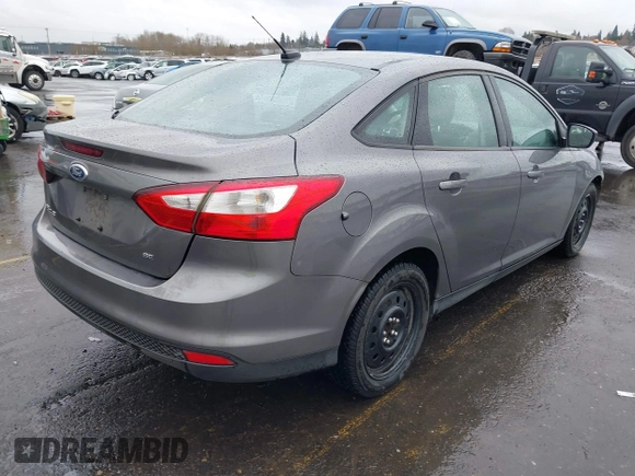 2012 Ford Focus SE with VIN 1FAHP3F24CL217777, listed as a IAAI auction lot 41831391 with 218,308 mi miles. Bid and sale history available at carsss.com. Image 4.