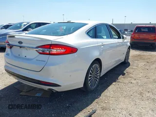 2017 Ford Fusion Titanium with VIN 3FA6P0SUXHR147336, listed as a IAAI auction lot 41873106 with 103,247 mi miles and . Bid and sale history available at DreamBid. Image 4.