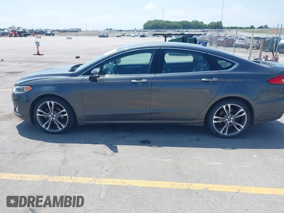 2020 Ford Fusion Titanium with VIN 3FA6P0D9XLR131042, listed as a IAAI auction lot 42560444 with 95,351 mi miles and . Bid and sale history available at DreamBid. Image 14.