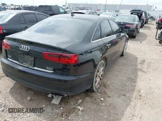 2016 Audi A6 2.0T Premium Plus with VIN WAUGFAFC1GN012799, listed as a IAAI auction lot 42141346 with 101,506 mi miles. Bid and sale history available at carsss.com. Image 4.