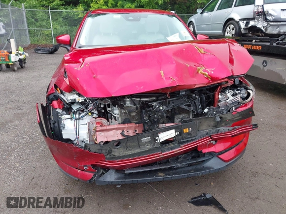2019 Mazda CX-5 Grand Touring with VIN JM3KFBDM8K0693622, listed as a IAAI auction lot 42503818 with 60,812 mi miles and . Bid and sale history available at DreamBid. Image 6.