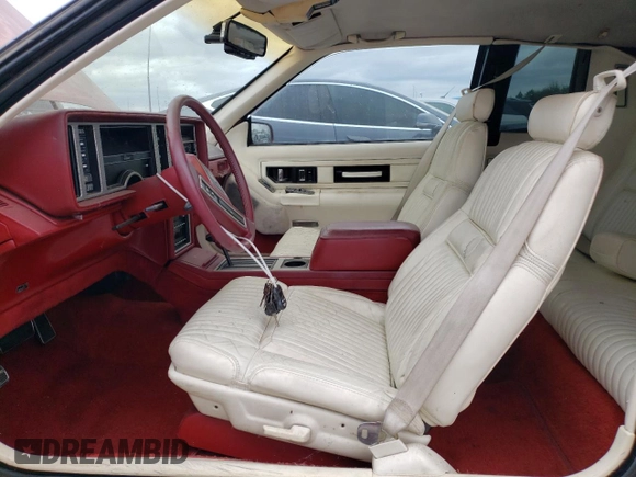 1986 Cadillac Eldorado z VIN 1G6EL5784GU616263, wystawiony jako Copart lot #48741325 z przebiegiem 59 213 mil mil oraz Tytuł czysty. Historia ofert i sprzedaży dostępna na DreamBid. Obrazek 7.