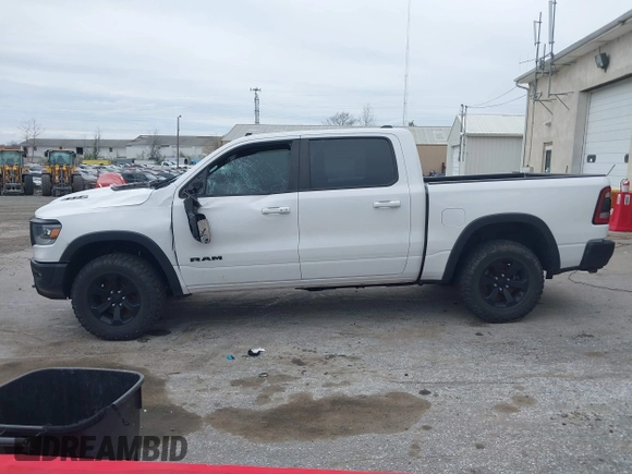 2022 Ram 1500 Rebel z VIN 1C6SRFLT1NN267513, wystawiony jako IAAI lot #41961821 z przebiegiem 140 488 mil mil oraz . Historia ofert i sprzedaży dostępna na DreamBid. Obrazek 15.