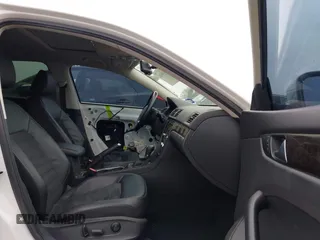 2014 Volkswagen Passat TDI SEL Premium with VIN 1VWCN7A32EC035738, listed as a IAAI auction lot 41641843 with 151,159 mi miles. Bid and sale history available at carsss.com. Image 5.