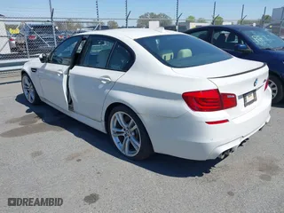 2013 BMW M5 with VIN WBSFV9C58DC773268, listed as a IAAI auction lot 41890830 with 128,399 mi miles. Bid and sale history available at carsss.com. Image 3.