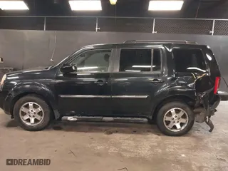 2011 Honda Pilot Touring with VIN 5FNYF4H97BB099528, listed as a IAAI auction lot 41721800 with 132,979 mi miles. Bid and sale history available at carsss.com. Image 14.