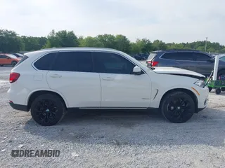 2016 BMW X5 xDrive35i z VIN 5UXKR0C55G0P32557, wystawiony jako IAAI lot #42235246 z przebiegiem 104 947 mil mil oraz . Historia ofert i sprzedaży dostępna na DreamBid. Obrazek 13.