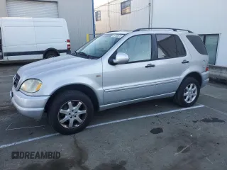 2000 Mercedes-Benz M 320/430/500 with VIN 4JGAB72E0YA167962, listed as a Copart auction lot 89158575 with 194,471 mi miles and Salvage title. Bid and sale history available at DreamBid. Image 1.