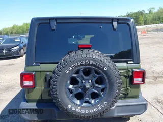 2023 Jeep Wrangler Sport S with VIN 1C4HJXDN0PW695795, listed as a IAAI auction lot 41974691 with 32,734 mi miles and . Bid and sale history available at DreamBid. Image 16.