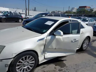2010 Cadillac CTS with VIN 1G6DA5EG7A0135451, listed as a IAAI auction lot 41964313 with 136,172 mi miles and . Bid and sale history available at DreamBid. Image 6.