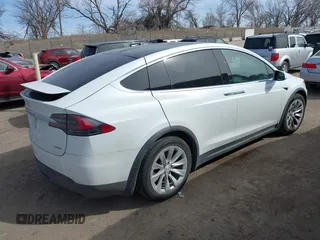 2018 Tesla Model X 75D with VIN 5YJXCBE27JF121834, listed as a IAAI auction lot 41769246 with 90,814 mi miles and . Bid and sale history available at carsss.com. Image 4.