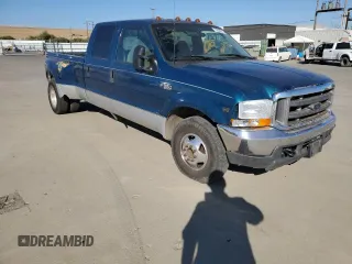2000 Ford F-350 with VIN 1FTWW32S9YED99031, listed as a Copart auction lot 75952254 with 220,673 mi miles and Salvage title. Bid and sale history available at DreamBid. Image 4.