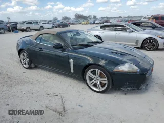 2007 Jaguar XK with VIN SAJWA44C779B12243, listed as a Copart auction lot 77239534 with 0 mi miles and Salvage Title. Bid and sale history available at carsss.com. Image 4.