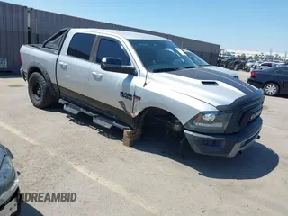 2016 Ram 1500 Rebel z VIN 1C6RR7YT5GS251994, wystawiony jako IAAI lot #42139378 z przebiegiem 102 736 mil mil oraz . Historia ofert i sprzedaży dostępna na DreamBid. Obrazek 1.