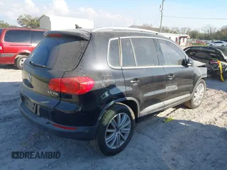 2012 Volkswagen Tiguan SE with VIN WVGAV7AX8CW565863, listed as a IAAI auction lot 41528643 with 122,569 mi miles and . Bid and sale history available at DreamBid. Image 4.