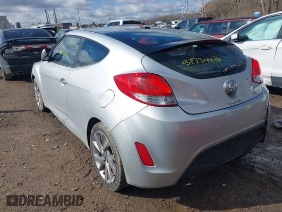 2017 Hyundai Veloster with VIN KMHTC6AD6HU310694, listed as a IAAI auction lot 41734446 with 99,432 mi miles. Bid and sale history available at carsss.com. Image 3.