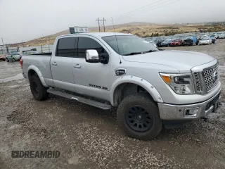 2016 Nissan Titan XD PRO-4X with VIN 1N6BA1F45GN517682, listed as a Copart auction lot 79774674 with 149,675 mi miles and Salvage Title. Bid and sale history available at carsss.com. Image 4.