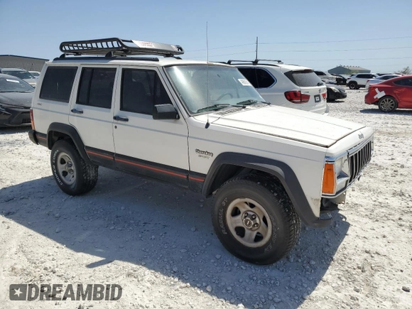 1996 Jeep Cherokee Sport with VIN 1J4FJ68S1TL128597, listed as a Copart auction lot 49600545 with 201,074 mi miles and Salvage title. Bid and sale history available at DreamBid. Image 4.