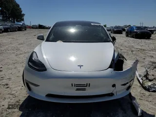 2023 Tesla Model 3 with VIN 5YJ3E1EA9PF558088, listed as a Copart auction lot 52228465 with 63,204 mi miles and Salvage title. Bid and sale history available at DreamBid. Image 5.