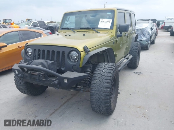 2008 Jeep Wrangler Unlimited Sahara with VIN 1J8GA59108L574959, listed as a IAAI auction lot 42171011 with Not Provided miles and . Bid and sale history available at carsss.com. Image 2.