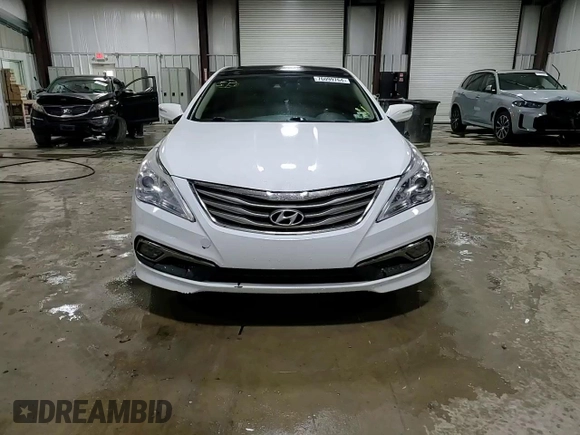 2015 Hyundai Azera Limited z VIN KMHFH4JG1FA448378, wystawiony jako Copart lot #76099764 z przebiegiem 117 489 mil mil oraz Szkoda całkowita • Salvage title. Historia ofert i sprzedaży dostępna na DreamBid. Obrazek 13.