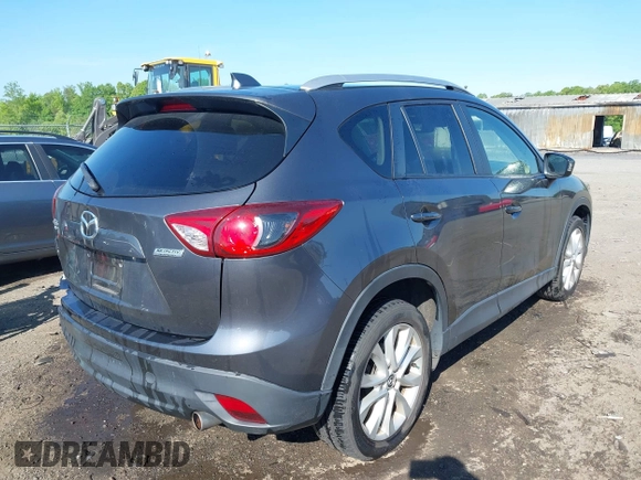 2014 Mazda CX-5 Grand Touring with VIN JM3KE4DY2E0312952, listed as a IAAI auction lot 42138721 with 99,993 mi miles and . Bid and sale history available at DreamBid. Image 4.
