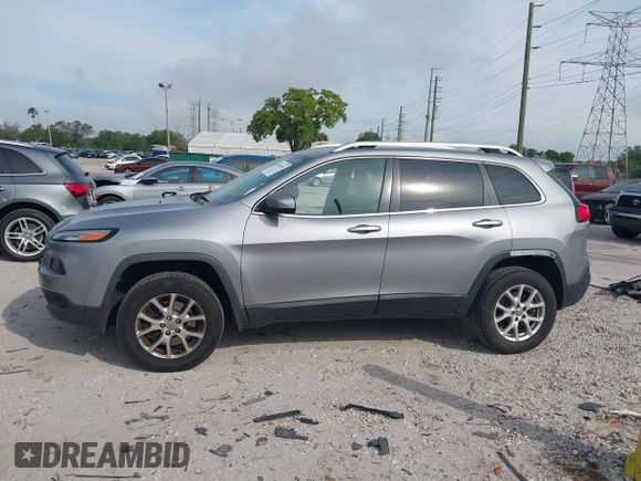 2014 Jeep Cherokee Altitude with VIN 1C4PJMCB4EW107556, listed as a IAAI auction lot 41881448 with 212,816 mi miles and . Bid and sale history available at DreamBid. Image 15.