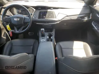 2019 Cadillac XT4 AWD Sport z VIN 1GYFZFR47KF152344, wystawiony jako Copart lot #57535655 z przebiegiem 70 107 mil mil oraz Szkody całkowita. Historia ofert i sprzedaży dostępna na DreamBid. Obrazek 8.