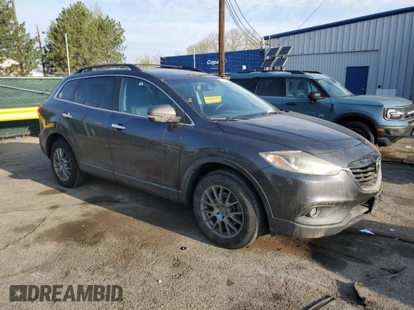 2015 Mazda CX-9 Grand Touring with VIN JM3TB3DV2F0453812, listed as a Copart auction lot 54445115 with 176,067 mi miles and Salvage title. Bid and sale history available at DreamBid. Image 4.