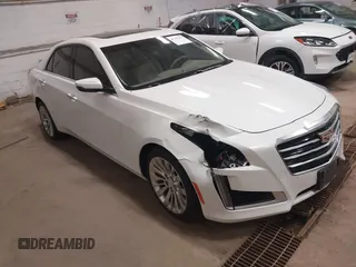 2016 Cadillac CTS Luxury Collection AWD z VIN 1G6AX5SS6G0125285, wystawiony jako IAAI lot #42137355 z przebiegiem 110 299 mil mil oraz . Historia ofert i sprzedaży dostępna na DreamBid. Obrazek 1.
