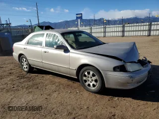 2002 Mazda 626 LX with VIN 1YVGF22C125279863, listed as a Copart auction lot 87103664 with 139,633 mi miles and Salvage Title. Bid and sale history available at carsss.com. Image 4.