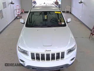 2014 Jeep Grand Cherokee Laredo with VIN 1C4RJFAG2EC198265, listed as a IAAI auction lot 42222664 with 117,447 mi miles and . Bid and sale history available at DreamBid. Image 1.