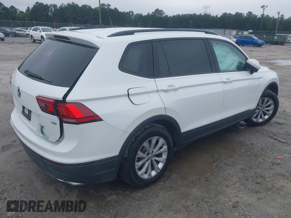 2018 Volkswagen Tiguan S with VIN 3VV1B7AX1JM032250, listed as a IAAI auction lot 42366790 with 65,406 mi miles and . Bid and sale history available at DreamBid. Image 4.