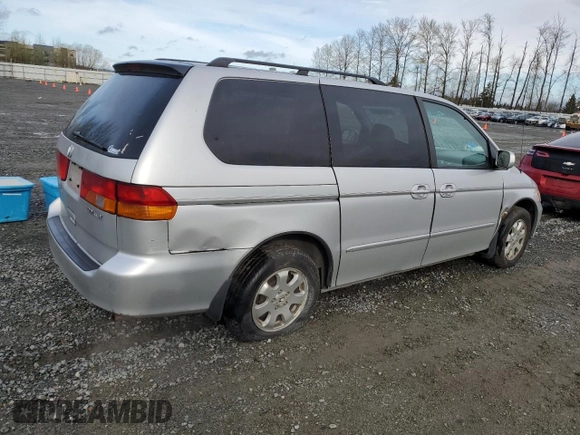 2002 Honda Odyssey EX z VIN 2HKRL18692H578746, wystawiony jako Copart lot #51281845 z przebiegiem 282 844 mil mil oraz Szkoda całkowita • Salvage title. Historia ofert i sprzedaży dostępna na DreamBid. Obrazek 3.
