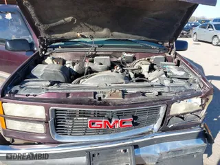 1997 GMC Suburban with VIN 1GKEC16RXVJ703491, listed as a IAAI auction lot 41219414 with NaN miles. Bid and sale history available at carsss.com. Image 10.