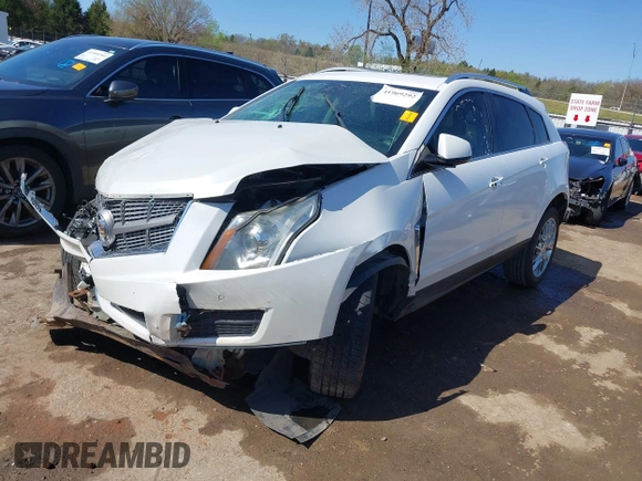 2014 Cadillac SRX Performance Collection with VIN 3GYFNCE38ES675508, listed as a IAAI auction lot 41969292 with 147,534 mi miles and . Bid and sale history available at DreamBid. Image 2.