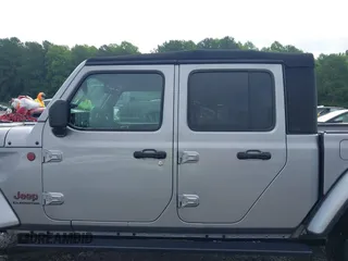 2020 Jeep Gladiator Rubicon z VIN 1C6JJTBG7LL181833, wystawiony jako IAAI lot #42493073 z przebiegiem 13 775 mil mil oraz . Historia ofert i sprzedaży dostępna na DreamBid. Obrazek 14.