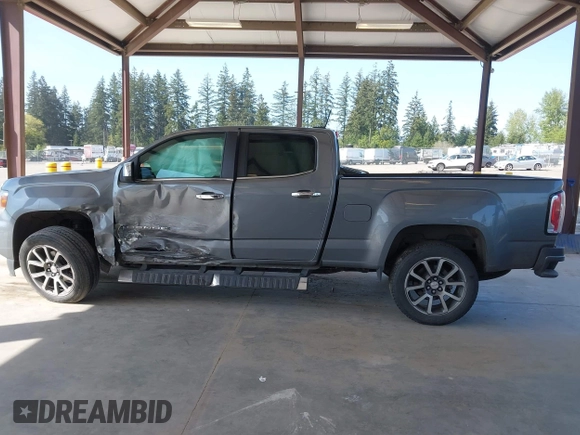 2021 GMC Canyon 4WD Denali with VIN 1GTG6EEN5M1102747, listed as a IAAI auction lot 42121134 with 60,412 mi miles and . Bid and sale history available at DreamBid. Image 14.