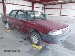 1991 Toyota Camry DLX z VIN 4T1SV21E4MU318875, wystawiony jako IAAI lot #42100394 z przebiegiem 177 009 mil mil oraz . Historia ofert i sprzedaży dostępna na DreamBid. Obrazek 1.