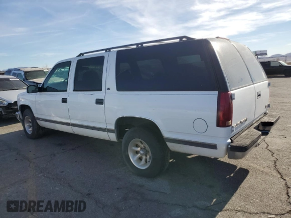 1999 GMC Suburban with VIN 3GKEC16R6XG538009, listed as a Copart auction lot 87112424 with 220,487 mi miles and Clean Title. Bid and sale history available at DreamBid. Image 2.