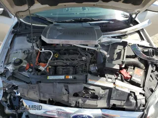 2010 Ford Fusion Hybrid with VIN 3FADP0L32AR308054, listed as a Copart auction lot 46930305 with 77,084 mi miles and Clean Title. Bid and sale history available at carsss.com. Image 12.