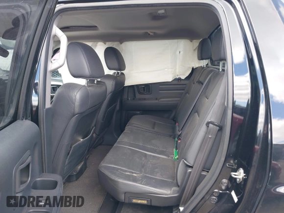 2013 Honda Ridgeline RTL with VIN 5FPYK1F50DB010368, listed as a IAAI auction lot 42048645 with 131,399 mi miles and . Bid and sale history available at DreamBid. Image 8.
