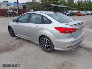 2015 Ford Focus SE with VIN 1FADP3F24FL297665, listed as a IAAI auction lot 41893672 with 105,719 mi miles. Bid and sale history available at carsss.com. Image 3.