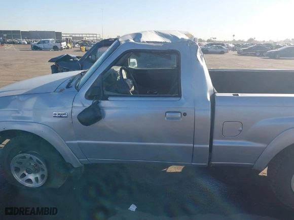 2002 Mazda B-Series 2WD Truck DS with VIN 4F4YR12U22TM11858, listed as a IAAI auction lot 40819886 with 104,051 mi miles. Bid and sale history available at carsss.com. Image 14.