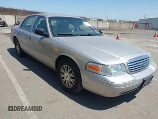 2005 Ford Crown Victoria LX z VIN 2FAFP74W75X166169, wystawiony jako IAAI lot #42406708 z przebiegiem 85 372 mil mil oraz . Historia ofert i sprzedaży dostępna na DreamBid. Obrazek 1.