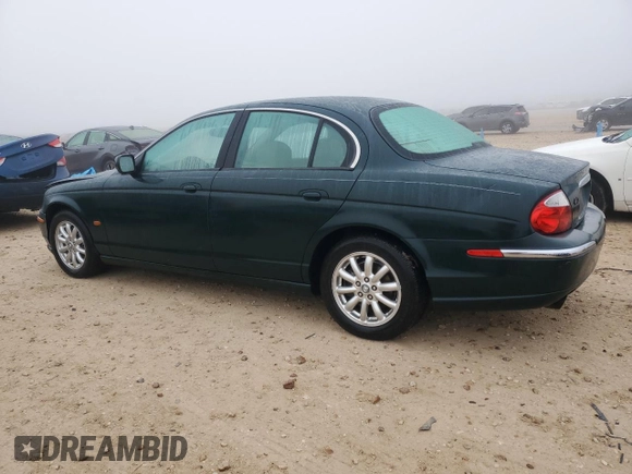 2002 Jaguar S-Type with VIN SAJDA01P12GM27242, listed as a Copart auction lot 88579215 with 218,546 mi miles and Salvage Title. Bid and sale history available at DreamBid. Image 2.