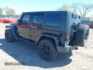 2010 Jeep Wrangler Unlimited Sahara with VIN 1J4HA5H17AL140941, listed as a IAAI auction lot 42004203 with 126,100 mi miles. Bid and sale history available at carsss.com. Image 3.