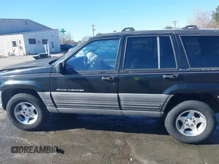 1996 Jeep Grand Cherokee Laredo with VIN 1J4GZ58S9TC268615, listed as a IAAI auction lot 41527984 with 248,443 mi miles. Bid and sale history available at carsss.com. Image 14.