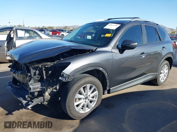 2016 Mazda CX-5 Touring with VIN JM3KE2CY4G0695947, listed as a IAAI auction lot 41824490 with 162,191 mi miles and . Bid and sale history available at carsss.com. Image 18.
