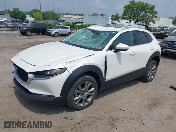 2021 Mazda CX-30 Premium with VIN 3MVDMBDL0MM307045, listed as a IAAI auction lot 42446494 with 33,112 mi miles and . Bid and sale history available at DreamBid. Image 2.